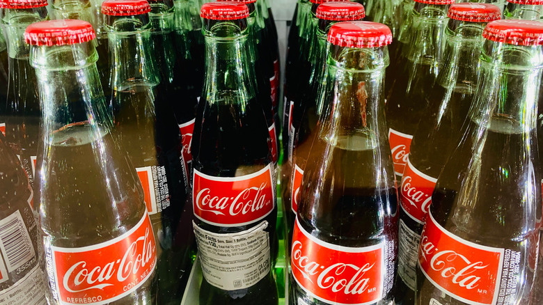 A group of Coca-Cola bottles