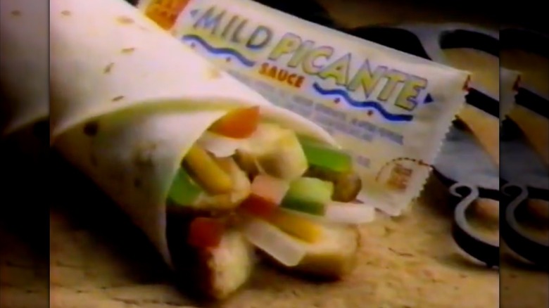 Screenshot of McDonald's chicken fajita in '90s commercial with mild picante sauce in background