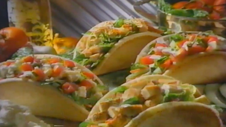 Screenshot from '90s commercial with four chicken caesar stuffed pitas from Wendy's