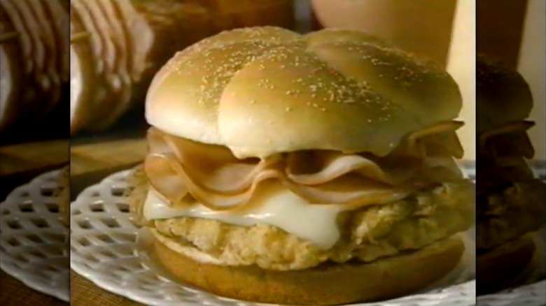 Screenshot from '90s ad featuring picture of Wendy's chicken cordon bleu sandwich on bun with cheese and ham