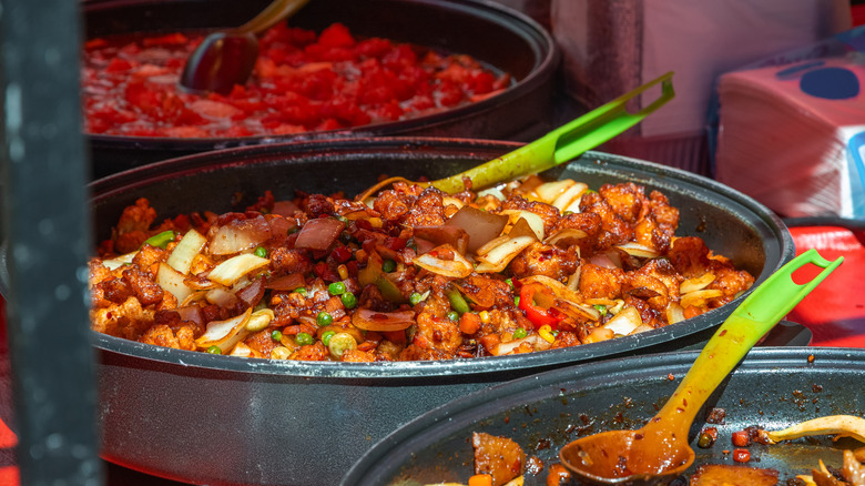 Kung pao chicken in a serving pan