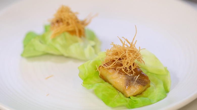 Black cod on lettuce