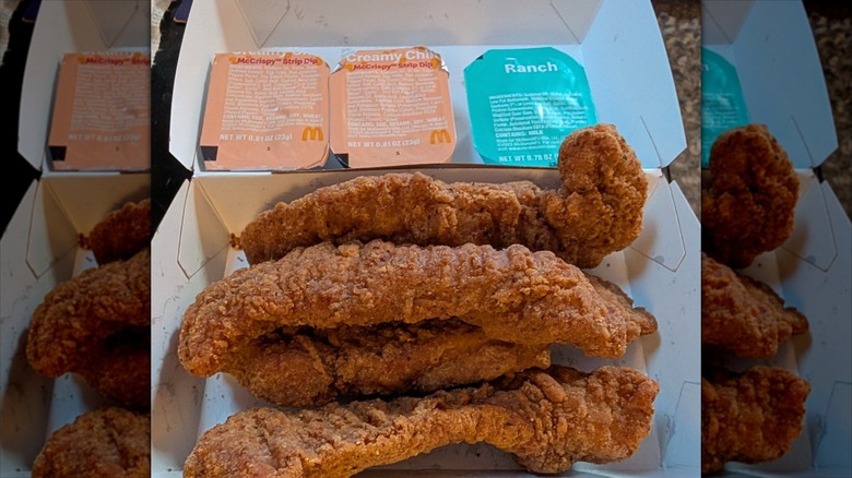 McDonald's McCrispy Strips and dipping sauces in to go box
