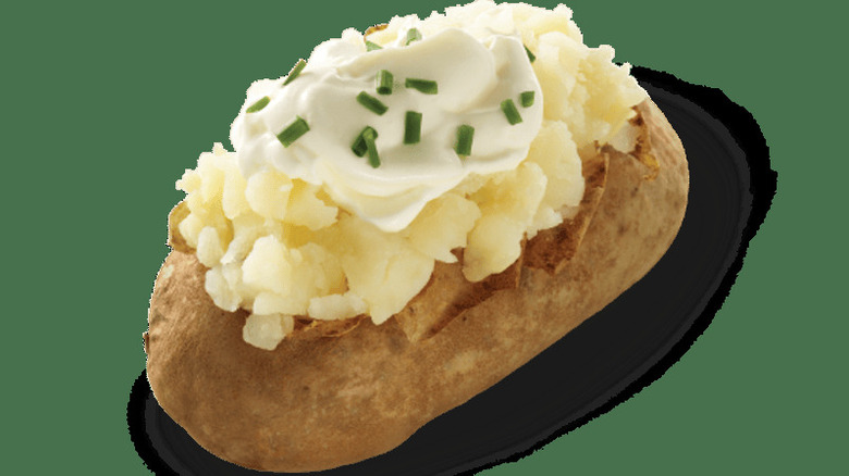 Wendy's baked potato on a green background