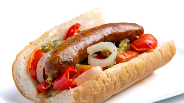 Sausage and raw onions on a bun