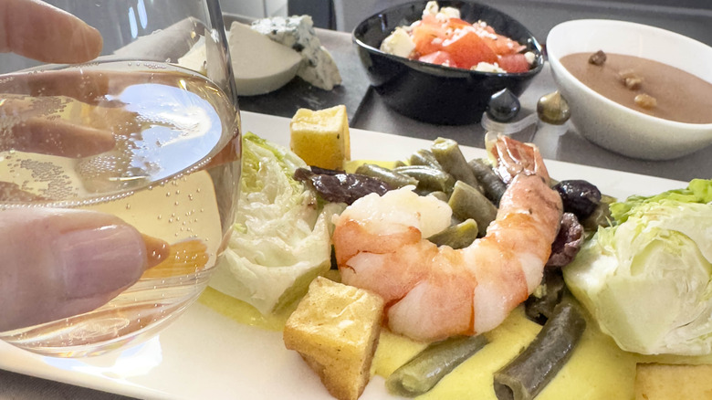 Shrimp and assorted food on a plane tray