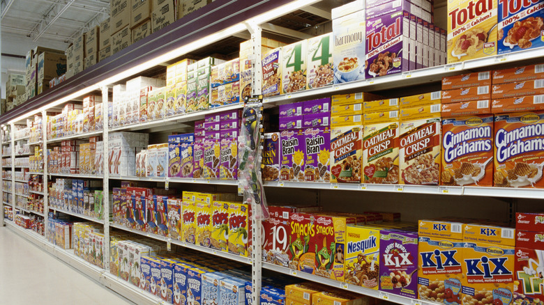 Boxes of assorted cereals on supermarket shelves