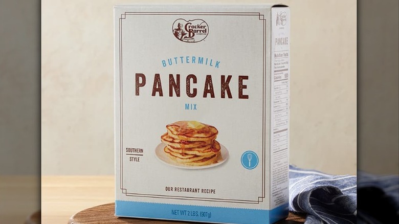 Cracker Barrel buttermilk pancake mix box with blue and white label on a wooden countertop