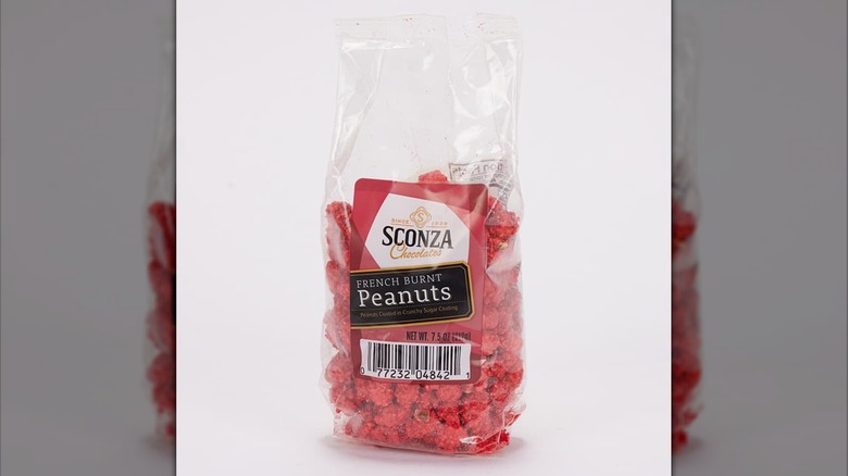 A clear bag of Sconza French burnt peanuts candy isolated on a white background