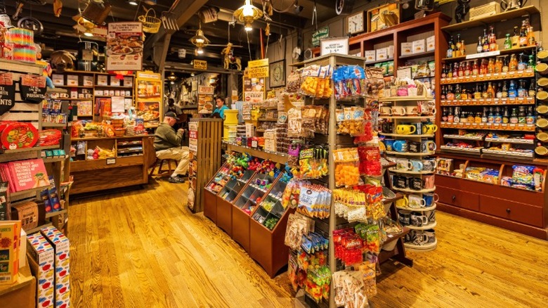 Inside of Cracker Barrel's Old Country Store with wooden shelves of vintage sodas, candies, and toys