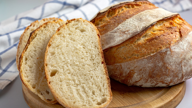 Loaf of bread on a wooden board