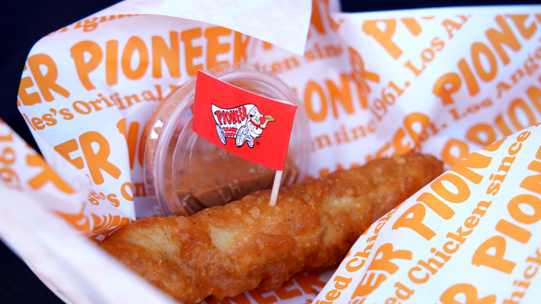 Pioneer Chicken finger with tiny flag and sauce