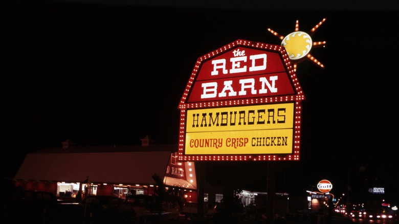 Red Barn sign illuminated at night