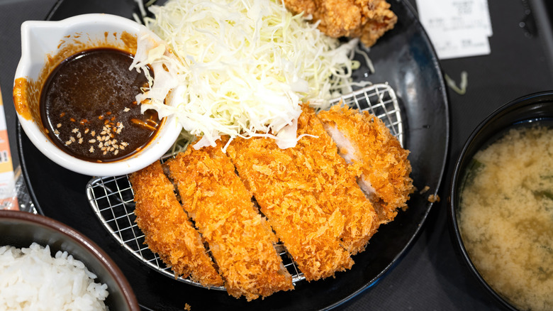 Deep-fried breaded pork tonkatsu sliced with a dipping sauce