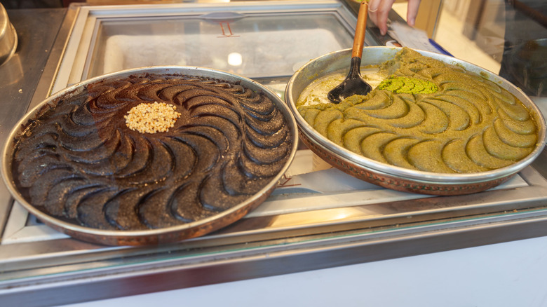 Halva in pans with serving spoon