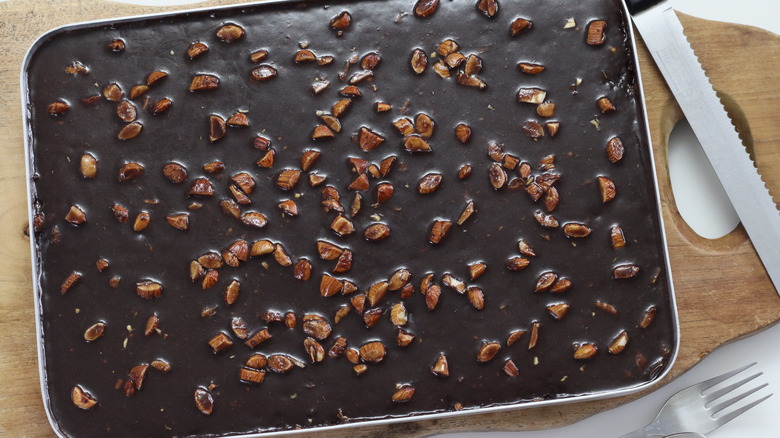 Texas funeral cake in pan next to knife and fork