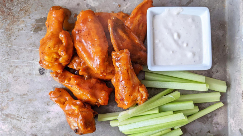 chicken wings, sauce, and celery