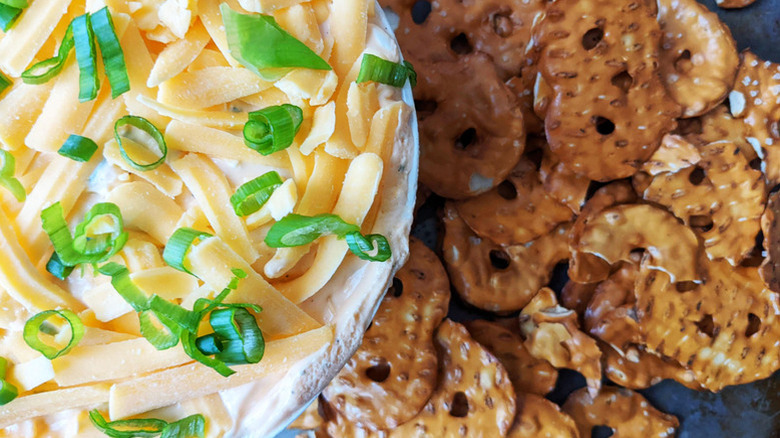 bowl with cheese and pretzels on the side