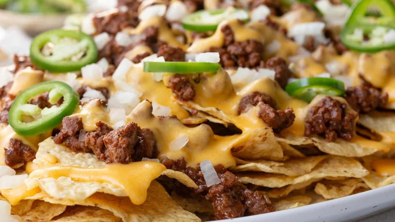 Chips with cheese, meat, onion, jalapeño