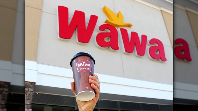 A cup of coffee from WaWa in front of the gas station.