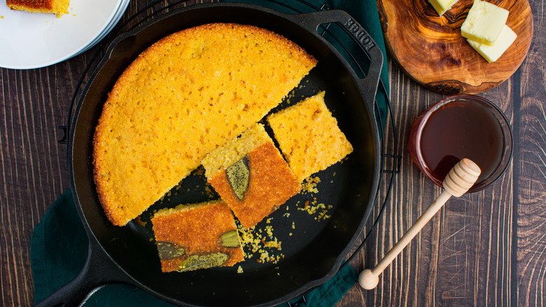 Sliced cornbread in a cast-iron skillet