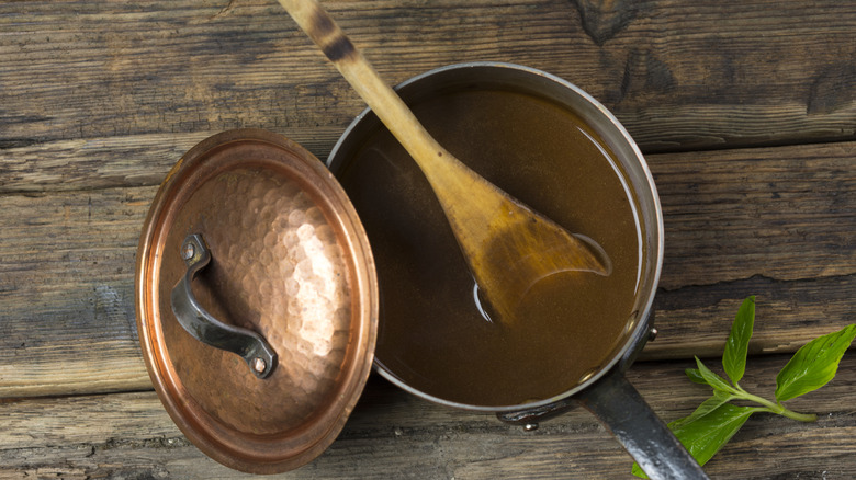Gravy in a copper pot top view