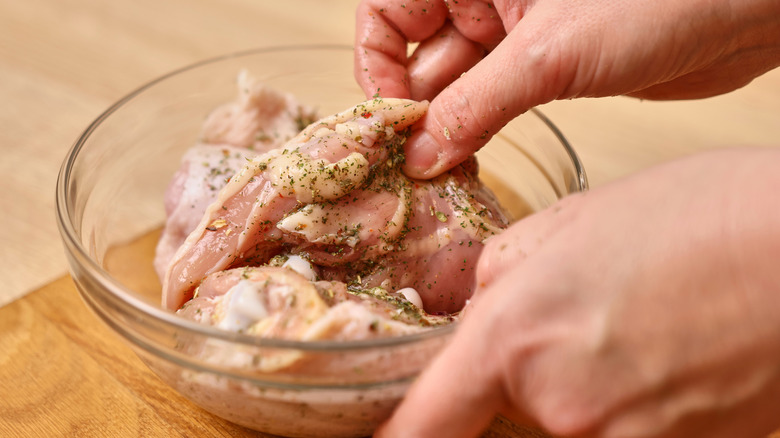 Chicken breast is marinated with spices and salt.