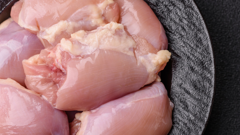 Raw chicken thigh fillets, boneless and skinless