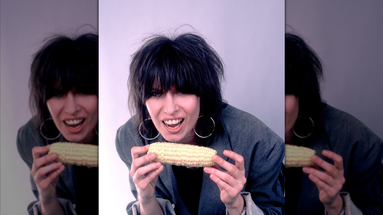 Chrissie Hynde of The Pretenders eating corn on the cob, mirrored