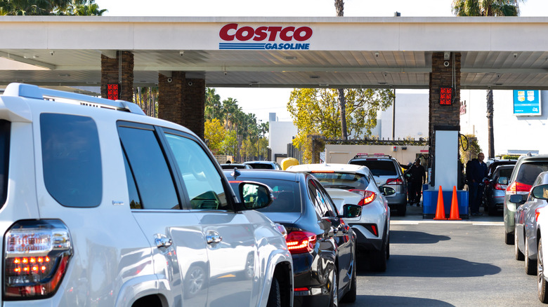A line of cars at a Costco gas station