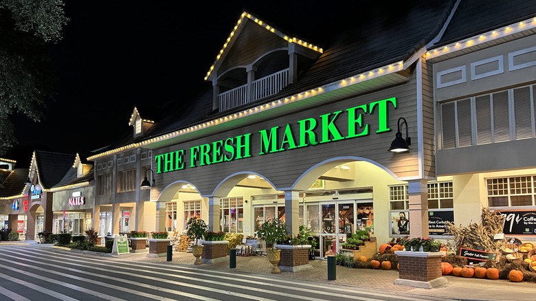 The Fresh Market storefront at night
