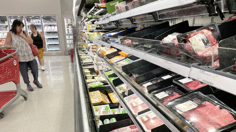 Customer shopping for meat at a Target grocery store