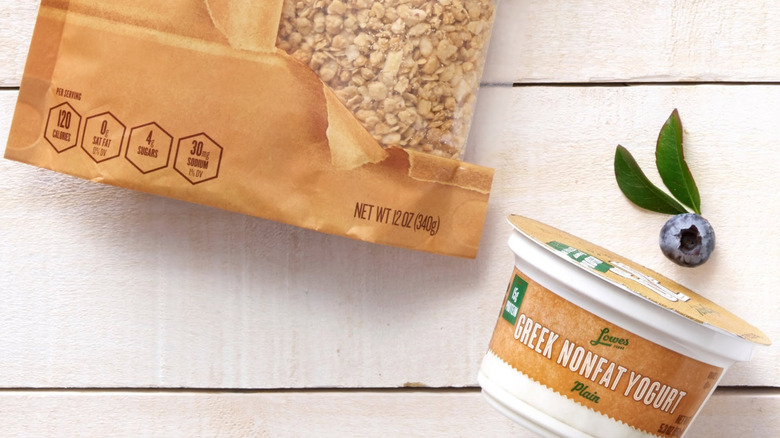 A bag of Lowes Brown Bag Morning Harvest Granola and Greek Nonfat Yogurt