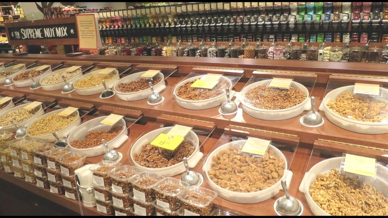 The Fresh Market bulk items aisle with nuts, dried fruit, seeds etc