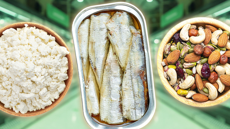 bowl of cottage cheese, sardines, and bowl of nuts on green background