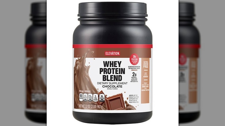A tub of Aldi's Elevation brand chocolate protein powder
