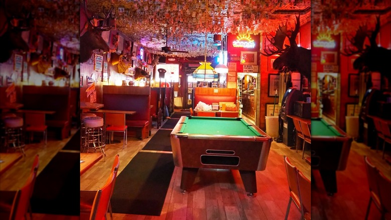 A pool table is inside of Shooting Star saloon.
