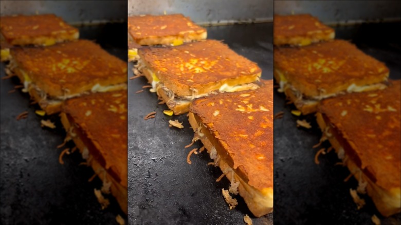 Porky's kauai grilled cheese sandwich cooking on the grill