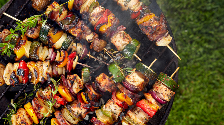 Skewers of meat being grilled