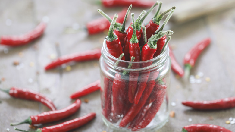red peppers stuffed in glass jar