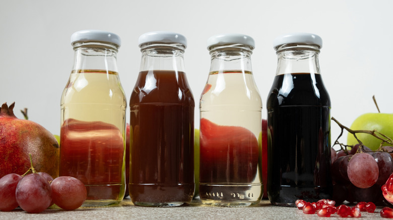 different types of vinegar in glass bottles