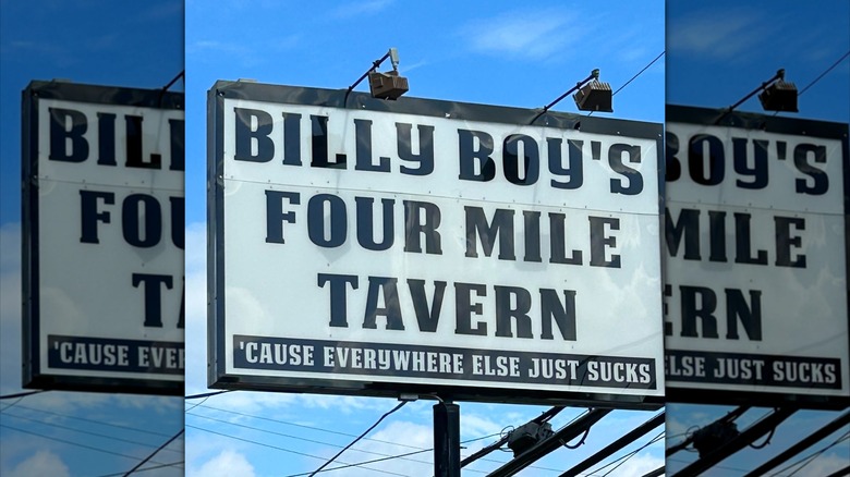 Exterior sign to Billy Boy's Four Mile Tavern, black font on white background