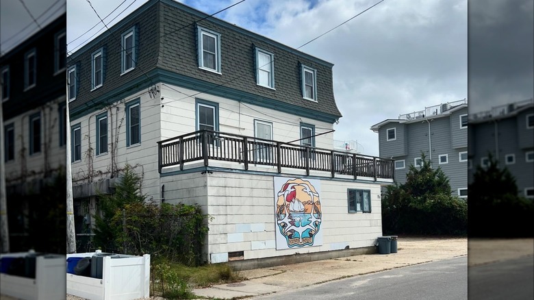 Exterior of Hudson House Bar, old, three-story building on street