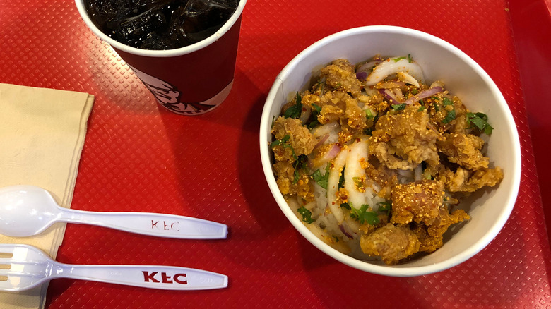 KFC bowl and soda on red tray