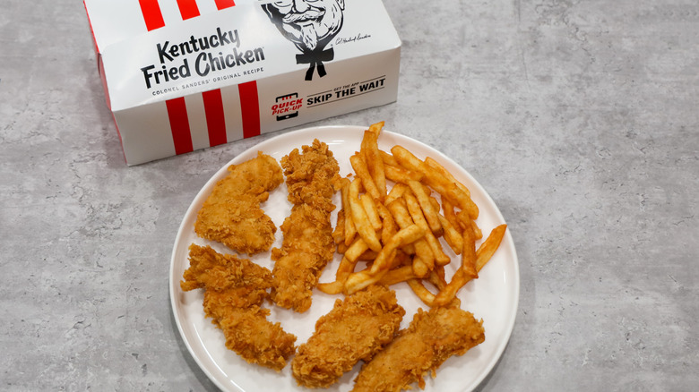 KFC chicken tenders with box in background.