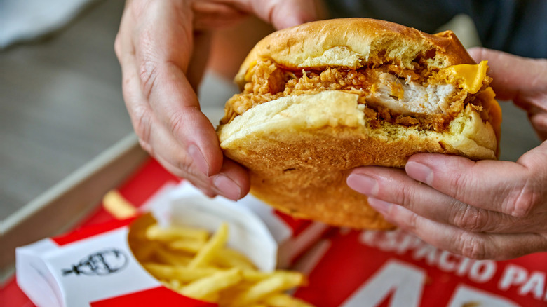 hands holing a KFC chicken sandwich