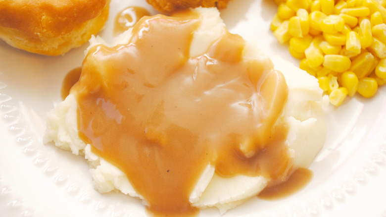 KFC mashed potatoes on plate with chicken and corn
