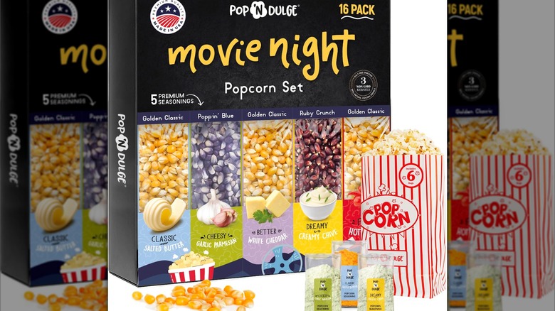 Movie Night Popcorn Set with seasoning mixes and popcorn bag in front of package on a white background.