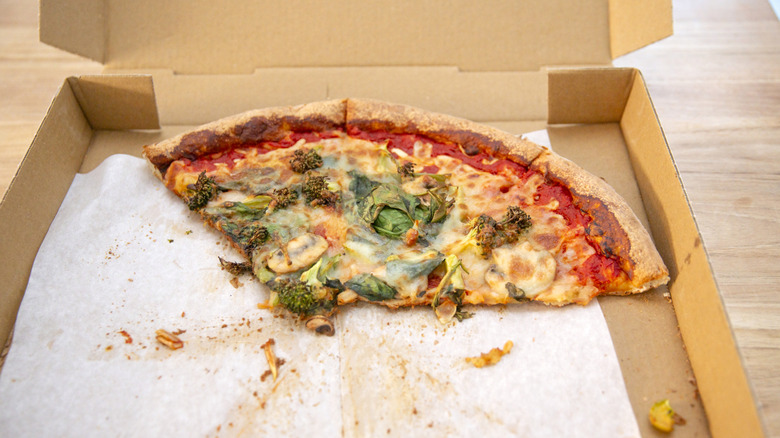 Leftover pizza in a box