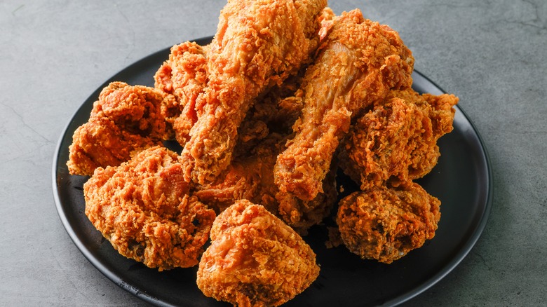 Fried chicken on a black plate